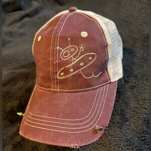 Custom trucker cap with white mesh back and alien decal.